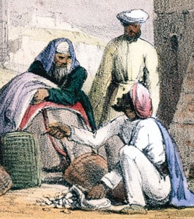 A print from 1845 shows cowry shells being used as money by an Arab trader. 