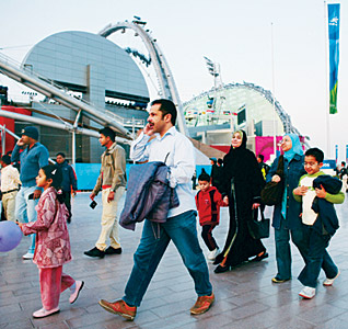 Spectators arrive at the newly renovated Khalifa Stadium in Doha.