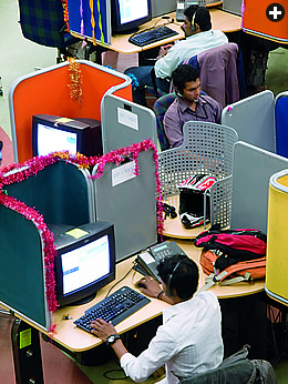 From Bangalore, right, employees at CL13L, a “Business Process Outsource” (BPO) center, help their company’s client customers in North America around the clock.