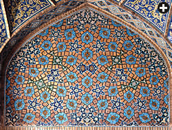 On this panel in the Shah Mosque in Isfahan, Iran, ten-pointed stars—none of them shown completely —anchor the edges of a pattern in which four of the five girih shapes can be found. Both the stars and the scallop-edged hexagons are placed according to an underlying design of still more decagons and pentagons. The stars’ incompleteness reminds the viewer that the pattern actually extends into infinity.