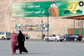 Nearby, a banner commemorates 37 years of rule by Muammar Qadhafi, who took power in 1969. 