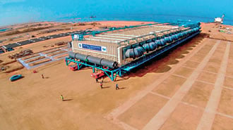 Setting a record that stood for two years, Almajdouie of Dammam, Saudi Arabia, moved the Heaviest Object Transported by Road—a single-piece, 4.9-million kilogram (10.8 million lb) evaporator for a desalination plant.