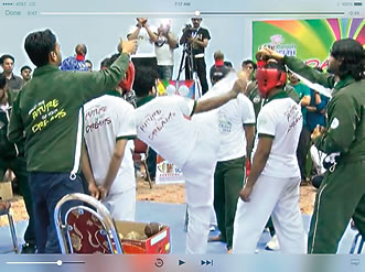 Guinness has honored claims of 32 records by the three-year-old Punjab Youth Festival in Lahore, Pakistan. Top: 1450 participants break the record for the Largest Number of People Simultaneously Arm Wrestling; above: Mohammad Rashid of Karachi kicks 50 coconuts off the heads of four courageous assistants.
