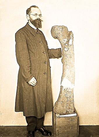 German paleontologist Ernst Freiherr [Baron] Stromer von Reichenbach posed with this fossil bone.