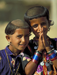 Young girls from a Muslim village near Jaisalmer, in the Thar Desert, wear distinctive tonsures. 