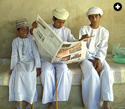 Young Omanis relax in the cool shade of the recently restored Restaq Fort. 