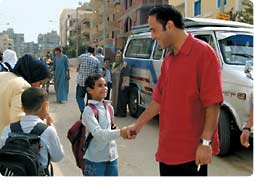 Abdel Baky meets a young fan outside the set.