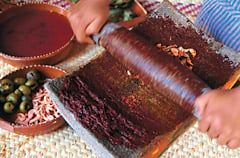 The grinding of mole ingredients is a culinary ritual in Mexico.