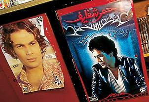 Pop posters show, from left, Egyptian pop heartthrob Amr Diab and Mohammed Mounir’s latest release “Ahmar Shafafe” (“Red Lipstick”). 