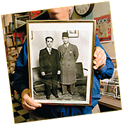 Ray holds a photo of his father, Albert Rashid, who posed with the Egyptian Mohammed Abdul Wahab (with fez) during Albert’s visit to Cairo in 1937, a time when he was beginning to import Arab films and music to the United States. 