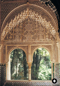 The Alhambra’s Mirador, or viewing turret, of Lindaraja, left, featuring a double-arched window with delicate muqarnas stalactites, overlooks a favored garden.