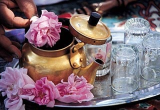 Rose water, product of the first round of distillation, can flavor tea if fresh roses are not at hand. 
