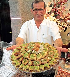 A sweet-shop assortment such as this might grace an elegant dinner party. Many Saudi sweets resemble those of other areas around the Mediterranean and the Arab world, in that a pastry is mixed, layered or wrapped around fillings of sugar, honey, lemon and nuts. Other desserts are based on dates, and puddings are made of rice and milk. 