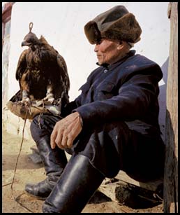Aske, 85, is one of the most renowned hunters in the Altai region. He holds a newly caught, hooded eagle to whose legs he has attached iakbo (jesses). Training it will take about three weeks. If it proves a good hunter, Aske will keep it—but for no more than 10 seasons before releasing it to the wild. 