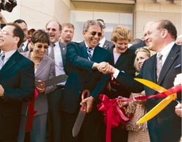 On May 5, with oversized scissors as ribbon-cutting props, Amre Moussa, secretary general of the Arab League, shakes hands with Dearborn Mayor Michael Guido, officially opening the Arab American nation Museum.