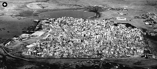 The view, taken in 1938, looks northwest over the old city. Still visible is the wall along the southern side, which stood until 1947. 