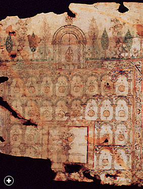 Showing greenery both outside the mosque wall (at top) and inside its courtyard (bottom), this gragment of an early eigth-century parchment Qur'an-one of the earliest known-helps document the close relationship of mosques and gardens. Though found in Sana', historians believe this fragment was probably produced in the Umayyad court of Damascus. 