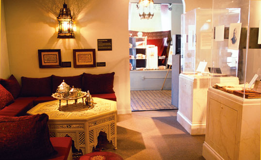 Couches, and a model tea set, lend atmosphere to the exhibit "Islamic Moorish Spain." 