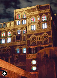 Lit from inside, traditional stained-glass windows add evening sparkle to the city that, in the ninth century, Ahmad 'Isa al-Rada'i called "Sana'a of the mansions and towers tall / High in antiquity, from time afore / Proud in resisting covetous assault. 