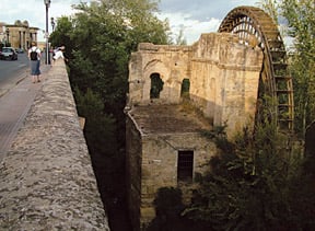 The Albolafia noria, or waterwheel, is the last vestige of an array of mills and dams built on the Guadalquivir River in Córdoba between the eighth and 10th centuries. It appears on this carved-stone seal of the city, left, and in its present condition, top. 