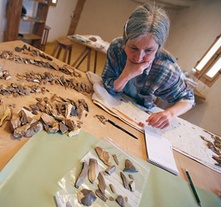 In the DOP lab, McDonald categorizes some of the project’s thousands of artifacts. 