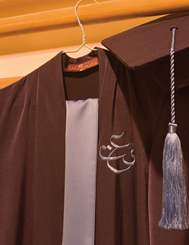 A baccalaureate robe awaits another year’s graduating class. The Arabic logo spells “Effat,” a name that means “integrity” or “uprightness.”