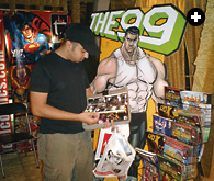 Days before the launch of The 99, a visitor in Kuwait’s Marina Mall looks over Arabic editions of Marvel comics.