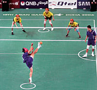 Facing opponents from Vietnam, Nitinadda Kaewkamsai of Thailand serves during the women’s final sepaktakraw match.