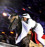 To light the cauldron that burned throughout the Games, Qatari endurance equestrian team captain Shaykh Muhammad bin Hamad Al-Thani rode his horse to the top of Khalifa Stadium.