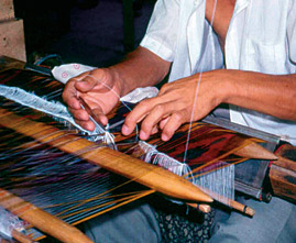Although the warp is silk, the weaver may use a simple cotton weft or, for a more luxurious fabric, a silk one. He can also add a supplementary silk weft to form loops that are later clipped to make a velvet fabric. 