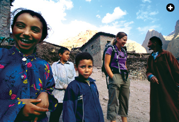 Author and climber Cloe Medina Erickson visits with local residents in Taghia.