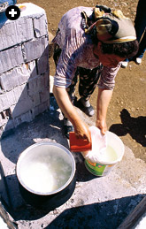 Sulfer Kazık straining the ayran, now salted, to make çökelek.