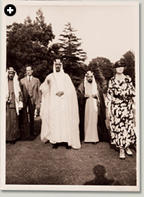 Lady Evelyn’s permission to make her pilgrimage was arranged by Saudi Arabia’s ambassador in London, Shaykh Hafiz Wahba, shown here during one of the visits to England (probably 1935) by HRH Prince Sa’ud ibn ‘Abd al-‘Aziz. Wahba stands on the left and slightly behind the prince; Wahba wrote the original introduction to Lady Evelyn’s Pilgrimage to Mecca. 