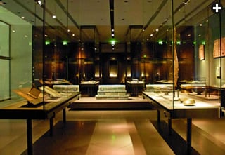 Artworks are carefully lit in tall cases set on bases of porphyry.