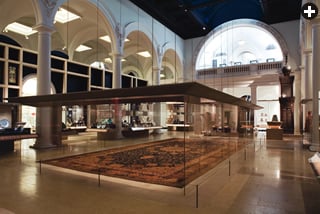 Protected by glass, the Ardabil carpet is the centerpiece of the V&A’s Jameel Gallery of Islamic Art.