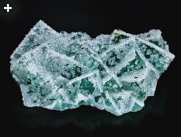 blue-green fluorite encrusted with white calcite