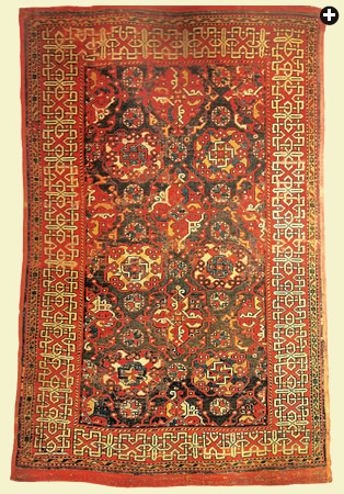 A “large-pattern Holbein” with four central squares and, above right, an Anatolian design whose strapwork border makes it akin to the carpet in Holbein’s portrait of Georg Gisze.