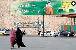 Nearby, a banner commemorates 37 years of rule by Muammar Qadhafi, who took power in 1969. 