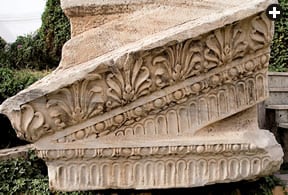 A stone from the Marcus Aurelius arch, carved more than 18 centuries ago, lies near the arch’s base in the madinah. 