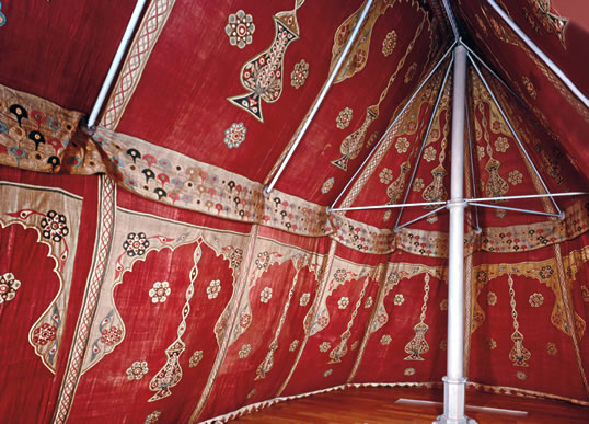Repeating rosettes, arches and images of hanging lamps decorate the interior of this 17th-century Ottoman tent. Real lamps would have been hung from the ridgepole. The tent was doubtless meant for an aristocrat or high-ranking administrator.