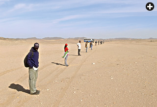 Students lined up to search the desert floor for meteorites.