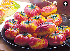 Pure marzipan comes in shapes and sizes limited only by the confectioner’s imagination. These are shaped like bite-sized tomatoes.
