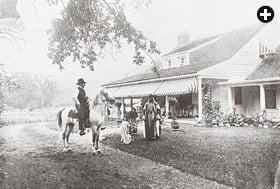 Davenport sits astride Muson, an Arabian stallion, at Red Gables, his home in Morris Plains. Said Abdullah stands next to a child who is believed to be Davenport’s daughter. 