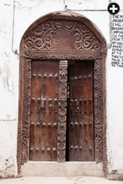 The recently restored 1890’s Old Dispensary was built by an Indian merchant. Inscriptions in the 18th-century reconstruction of the 12th-century mosque in Kizimkazi attribute its founding to Persian traders. The mosque’s door is styled like others from the Arabian Peninsula to India, inscribed in Arabic