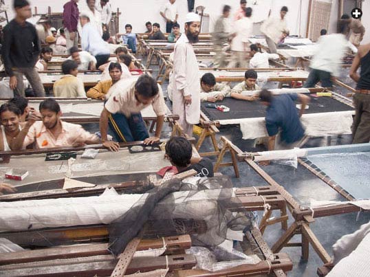 Working four, five or six to a frame, young craftsmen often choose the embroidery trade in pursuit of upward mobility.