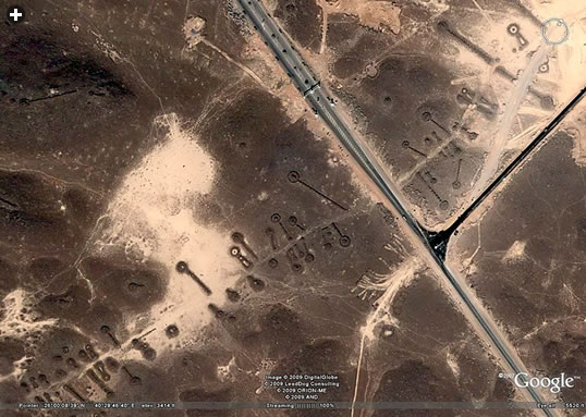 As these four images (above and below, right), three from the Al-Hayit region, show, keyhole and pendant shapes vary in size from a few meters to dozens of meters, and they are often found arranged along “avenues” that are invisible to builders of modern highways