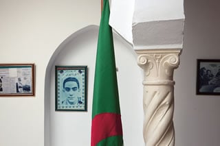 On the site where, in 1957, French paratroopers blew up the  house on Rue de Caton, killing Ali la Pointe and more than a dozen companions, there now stands a memorial with the Algerian flag and memorabilia.