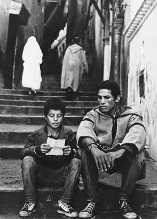 Played by Brahim Haggiag in a scene from the 1966 classic film The Battle of Algiers, Ali la Pointe listens to the young cousin of rebel leader Saadi Yacef.