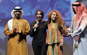 Waad Mohammed receives the Dubai International Film Festival's 2012 award for best actress in a feature film from HH Sheikh Mansoor bin Mohammed bin Rashid Al Maktoum.