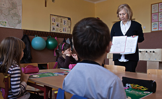 In a Białystok classroom, Maria Aleksandrowicz-Bukin, who chairs the Muslim Religious Association in that town, leads a lesson about Islam. 